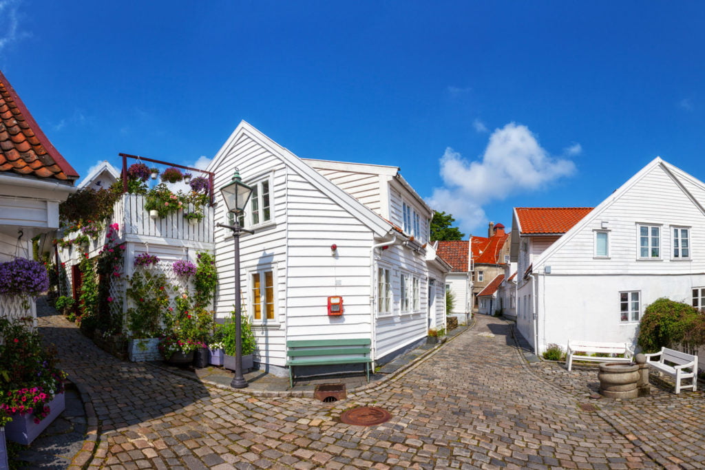 Street with white houses in the old part of Stavanger, Norway.